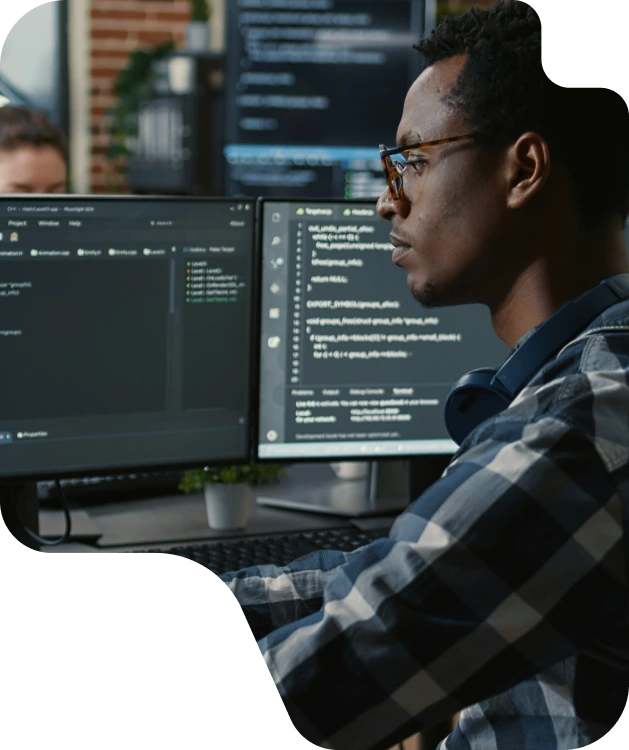 Developer reviewing SaaS code — no dark patterns at Snowball Creations